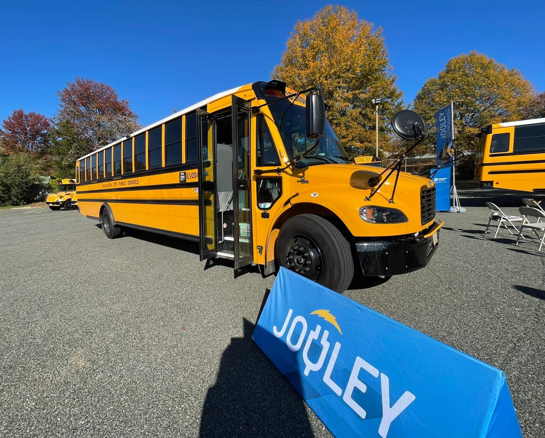 An electric school bus rolled out from Alexandria Public Schools