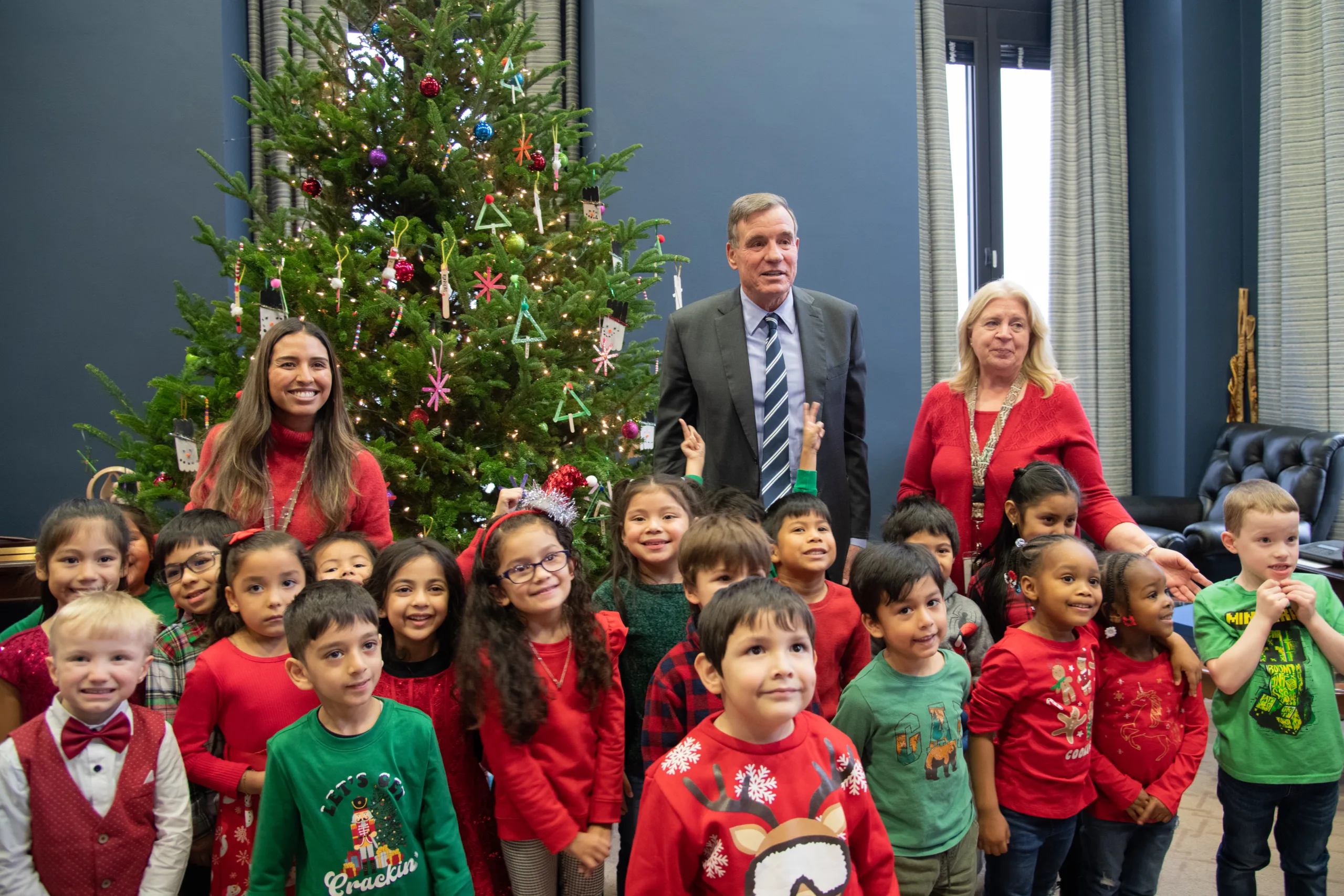 Inside Sen. Mark Warner’s annual holiday tradition at Capitol Hill: From handmade ornaments to festive serenades