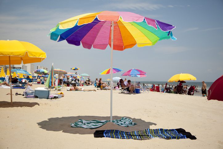 Colorful Beach Umbrella in the Sun at Virginia Beach. Visiting the beach is one of the area's best things to do.
