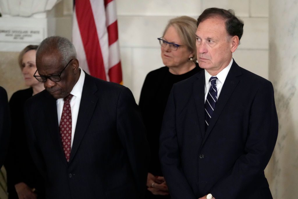 WASHINGTON, DC - DECEMBER 18: Supreme Court Justice Clarence Thomas and Justice Samuel Alito attend a private ceremony for retired Supreme Court Justice Sandra Day O'Connor before public repose in the Great Hall at the Supreme Court on December 18, 2023 in Washington, DC. O’Connor, the first woman appointed to be a justice on the U.S. Supreme Court, died at 93 on December 1. (Photo by Jacquelyn Martin-Pool/Getty Images)