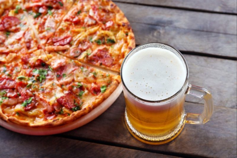 Pizza and a light draft beer