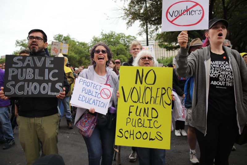 Photo of a group of parents protesting against school vouchers