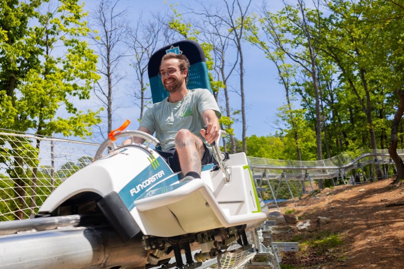 A man riding the first alpine coaster ride in Virginia