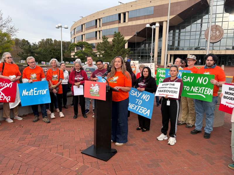 Protestors rally in Fairfax County on Oct. 9 against the proposed merger between Florida-based NextEra Energy and Dominion Energy.