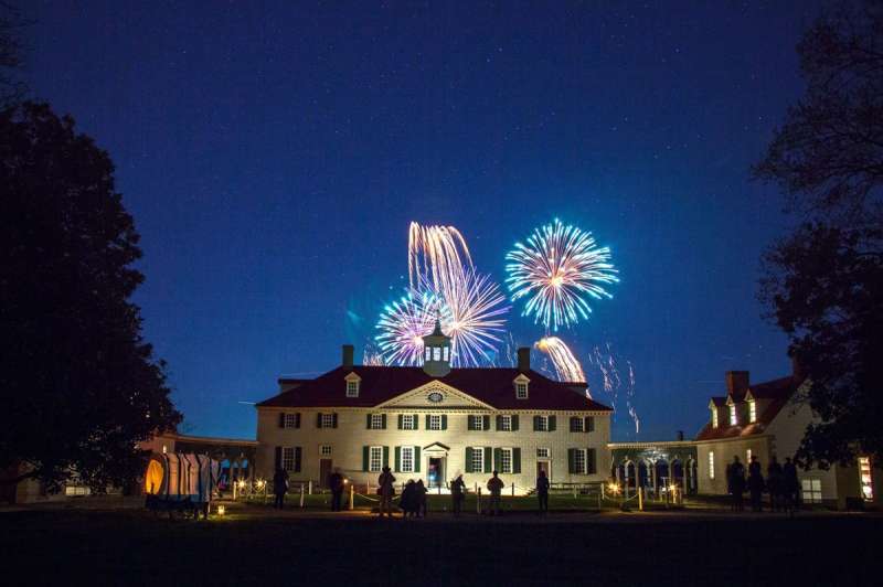 Fireworks over a historic house at one of the many winter festivals in Virginia